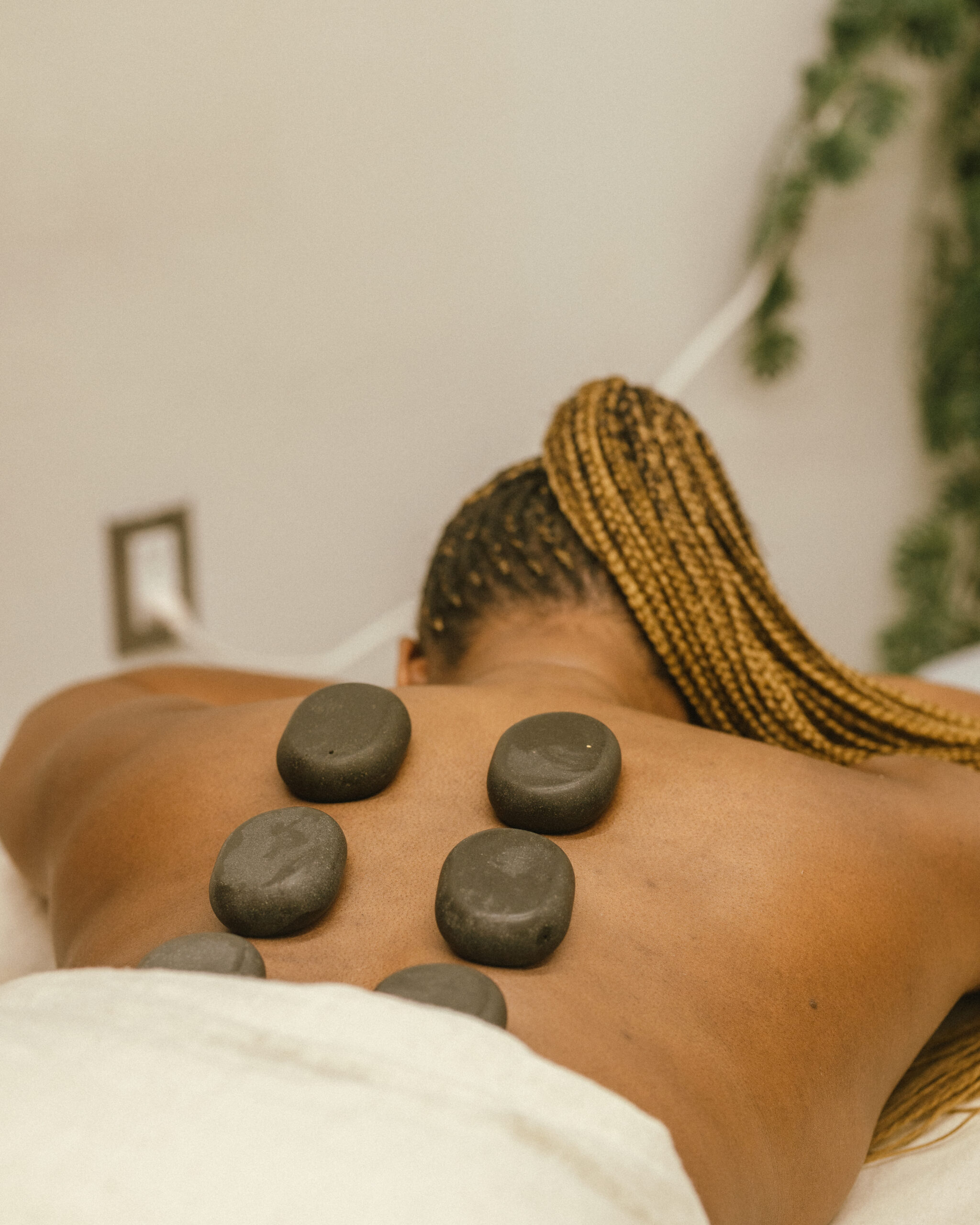 Hot stone therapeutic massage at Optimal Wellness Centre